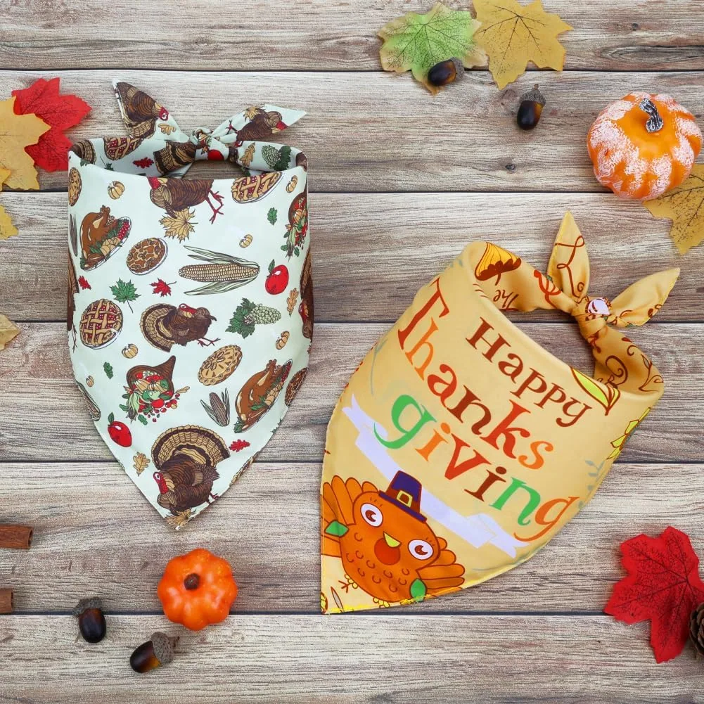 Two Vivifying Thanksgiving dog bandanas with turkey prints laid on wood