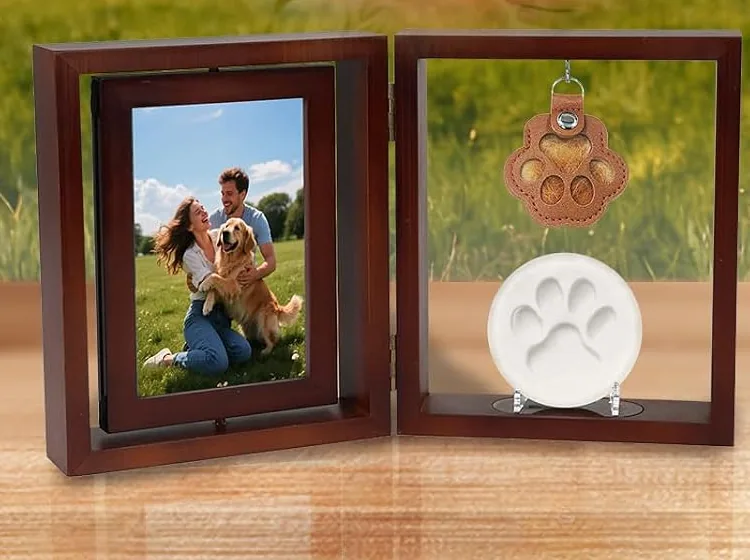A Vivifying memorial frame with a photo and a paw print on a wooden shelf
